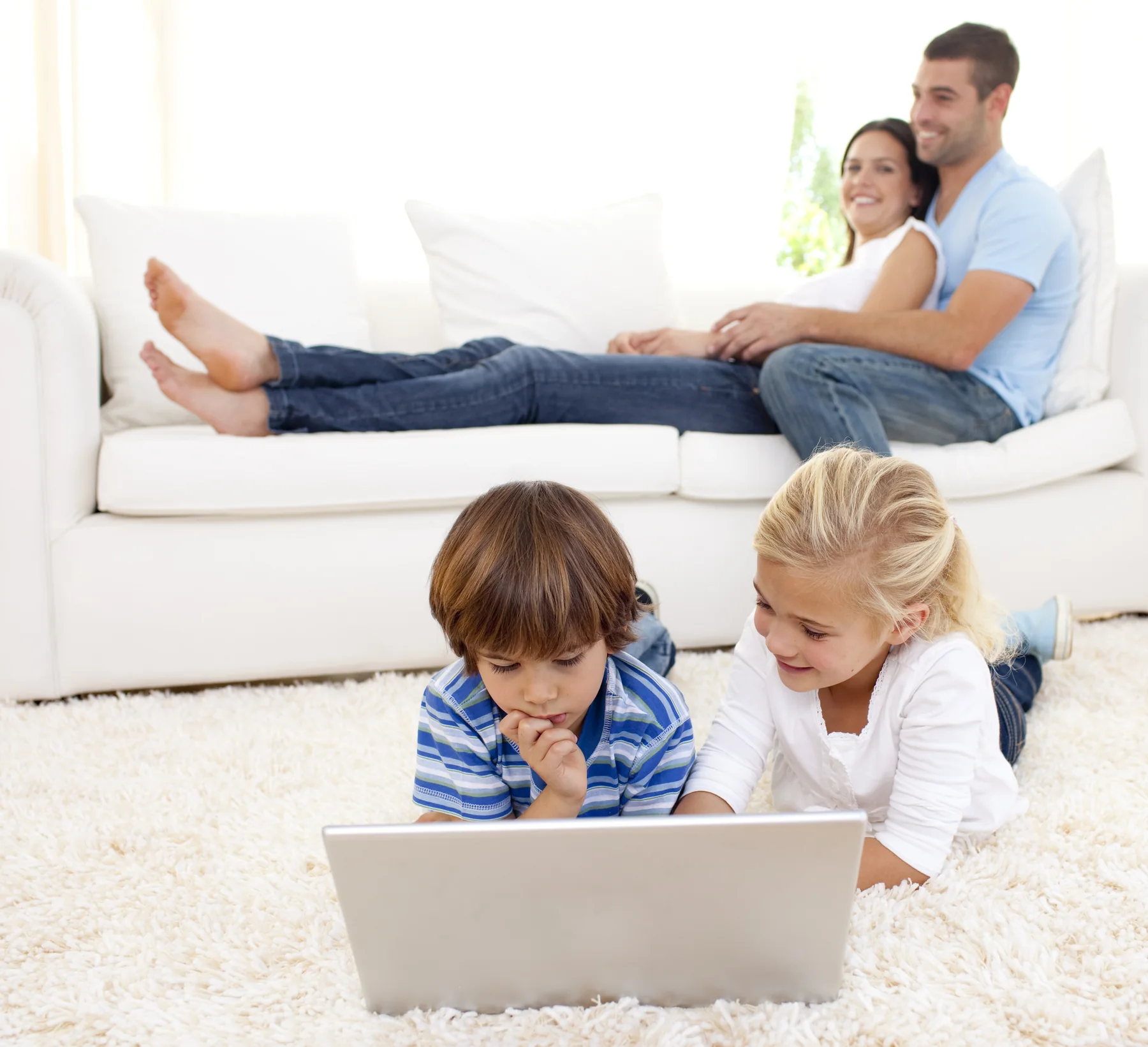 Family using digital devices together